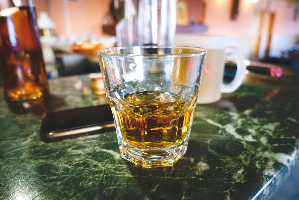 A cocktail being finished at the bar