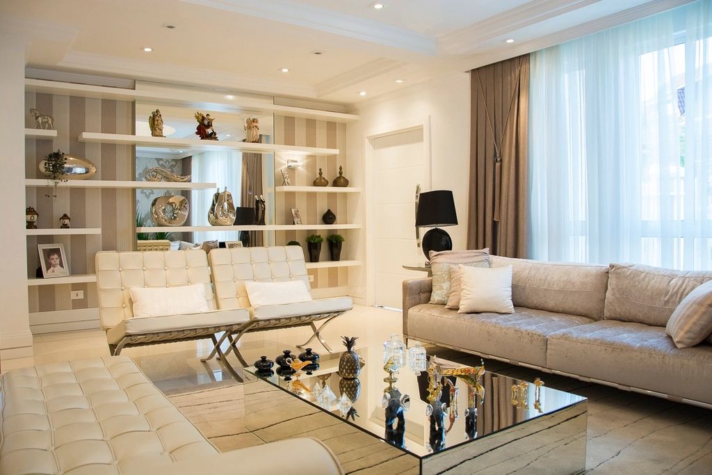 A suite sitting room with a sofa and armchairs